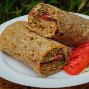 Read more about the article The Ugandan Rolex: A Street Food Icon with a Side of Culture